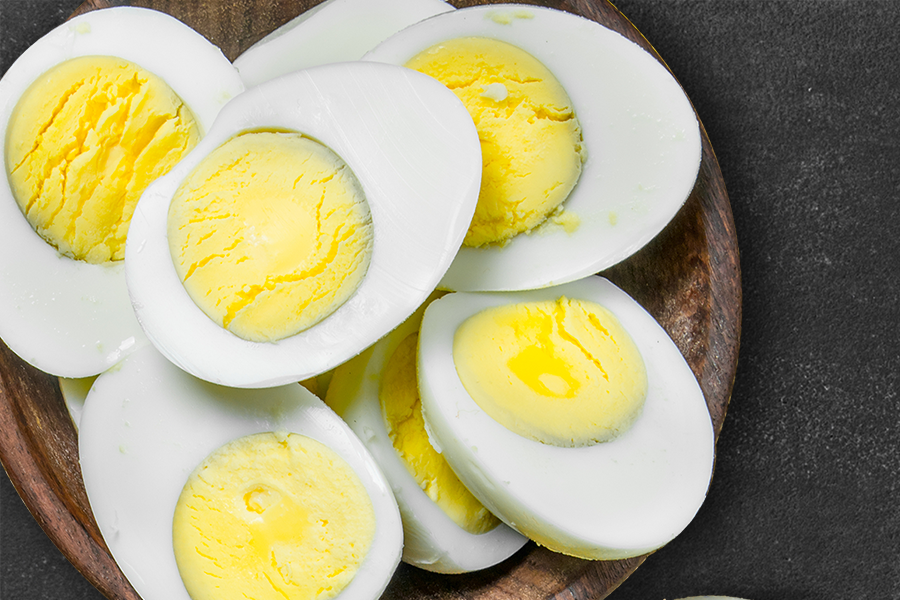 Boiled eggs cut into half and placed in a bowl